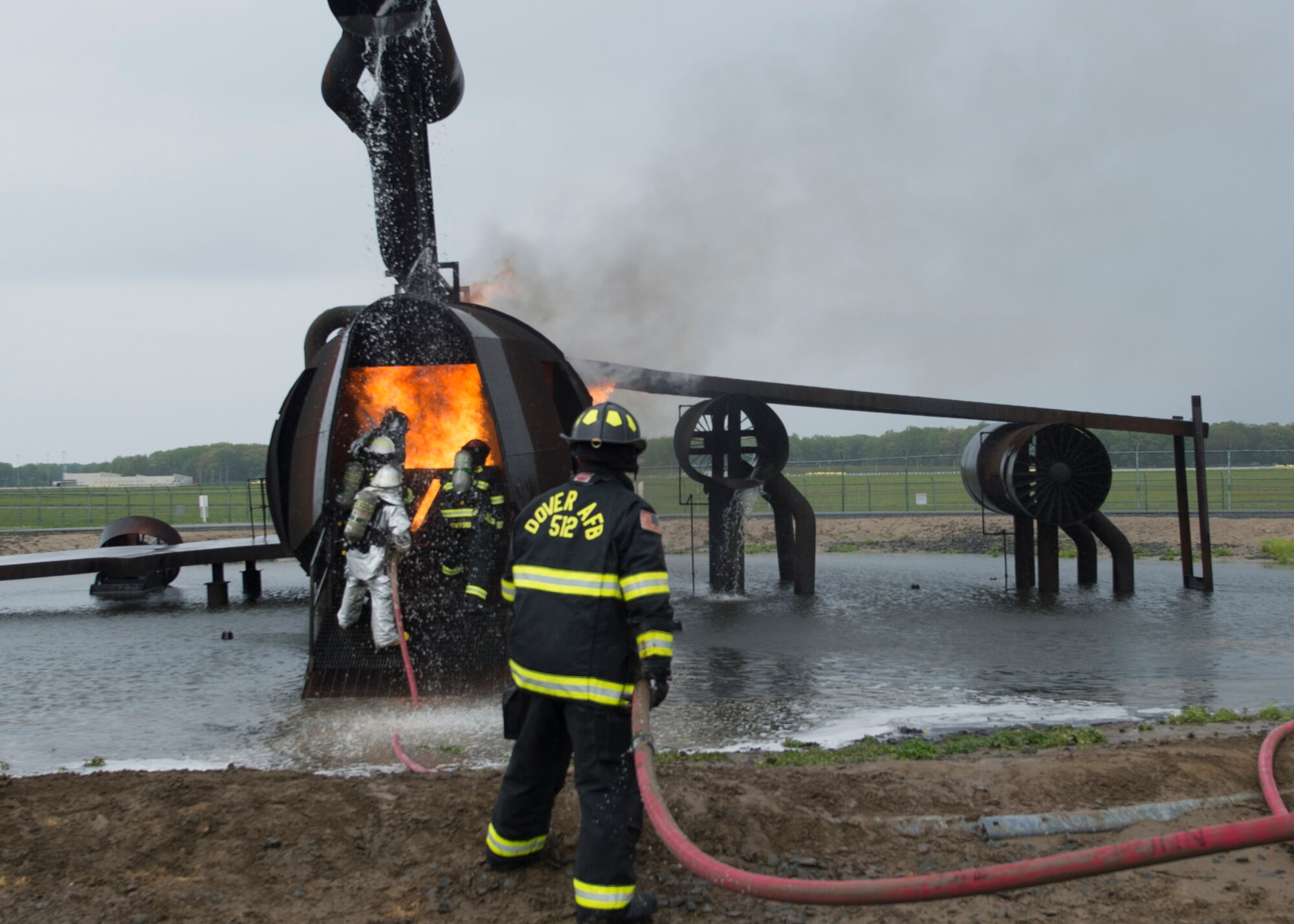 Airmen with the 512th Airlift Wing train fire-fighting skills as they extinguish an aircraft fire at Dover Air Force Base Del., April 23, 2016. This training occurs twice a year to keep the fire fighters current and proficient in their training requirements. (U.S. Air Force photo by Tech. Sgt. Nathan Rivard)