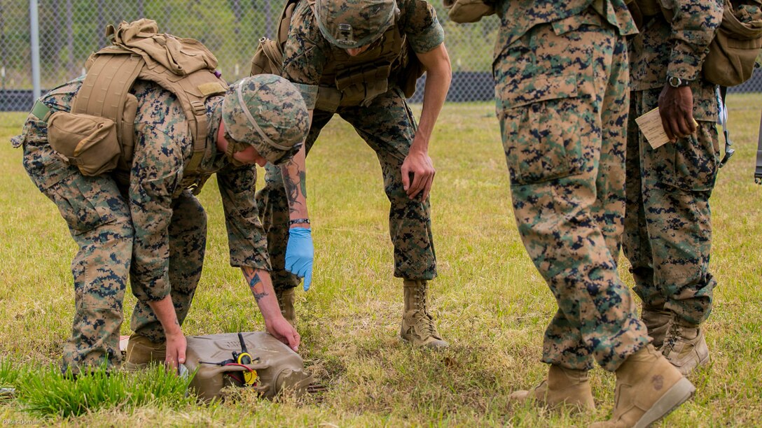 Marines delicately move an improvised explosive device to a staging area after it was properly disarmed and deemed safe during the Tactical Site Exploitation Course, taught by 2nd Law Enforcement Battalion, at Marine Corps Base Camp Lejeune N.C., April 20, 2016. The site exploitation course is a week long course that trains Marines how to remove and safely store evidence such as cigarette butts, computers and improvised explosive devices. 
