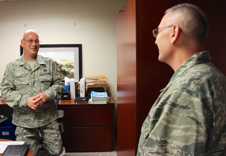 Historian of the 932nd Airlift Wing, Master Sgt. Gerald Sonnenberg, meets the new 932nd Airlift Wing commander, Col. Jonathan Philebaum, on April 2, 2016, at Scott Air Force Base, Illinois. Philebaum met with several Airmen, like Sonnenberg, during his immersion tour over the April unit training assembly. Philebaum visited the various sections within wing's staff agencies and learned more about each individual and their jobs within the 932nd AW. (U.S. Air Force photo by Maj. Stan Paregien)
