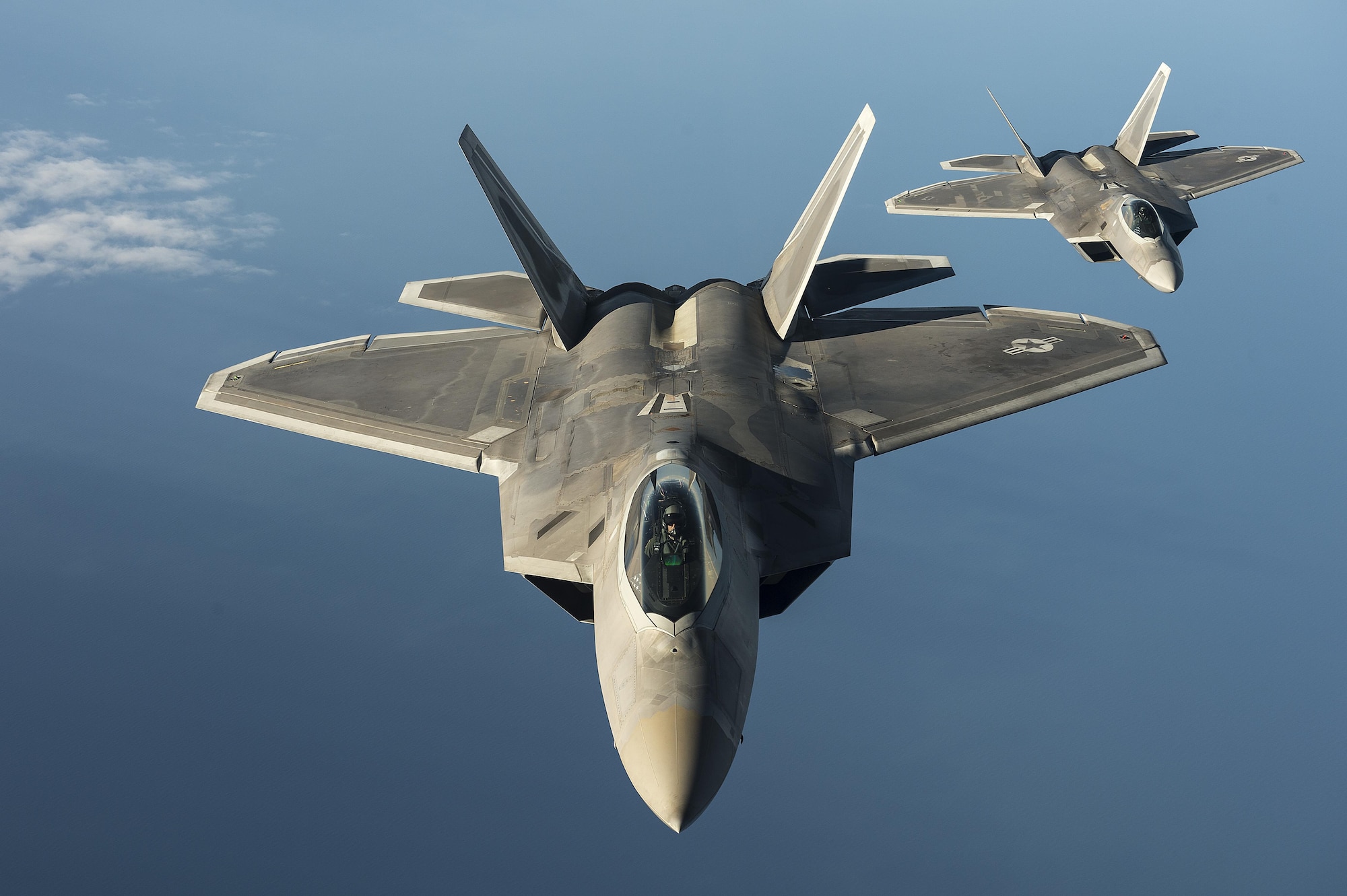Two F-22 Raptors from the 95th Fighter Squadron at Tyndall Air Force Base, Fla., fly over the Baltic Sea on Sept. 4, 2015. Like the F-22 deployment last year, two F-22s deployed to Mihail Kogalniceanu Air Base, Romania. While in Europe, U.S. Air Force aircraft and Airmen will conduct air training with other Europe-based aircraft. (U.S. Air Force photo/Tech. Sgt. Jason Robertson)