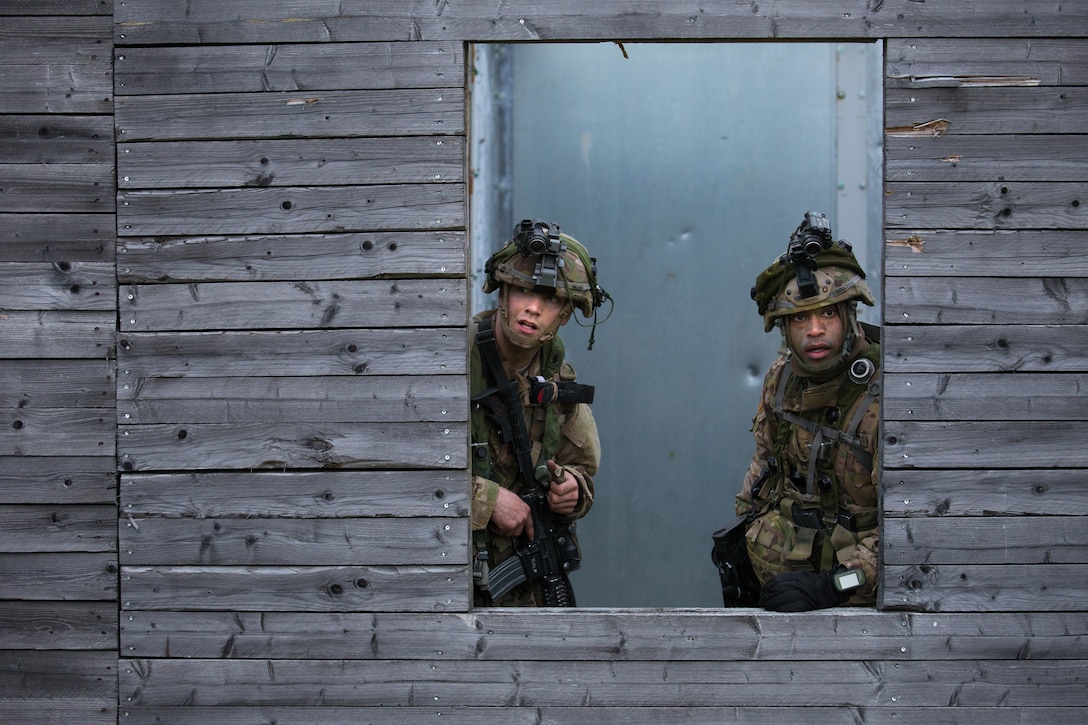 Soldiers scan for simulated enemies while participating in an air assault scenario during Saber Junction 16 in Grafenwoehr, Germany, April 18, 2016. The soldiers are assigned to the 503rd Infantry Regiment, 173rd Airborne Brigade. The Saber Junction 16 exercise includes nearly 5,000 participants from 16 NATO and European partner nations. Army photo by Pfc. Randy Wren