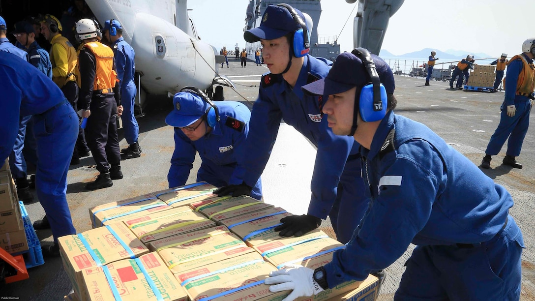 Japan Maritime Self Defense Force personnel, U.S. Navy sailors and U.S. Marines load supplies onto a U.S. Marine Corps MV-22B Osprey tiltrotor aircraft from Marine Medium Tiltrotor Squadron (VMM) 265 (Reinforced), 31st Marine Expeditionary Unit aboard the JS Hyuga, at sea, April 22, 2016. The supplies are in support of relief efforts after a series of earthquakes struck the island of Kyushu. The 31st MEU is the only continually forward-deployed MEU and remains the Marine Corps' force-in-readiness in the Asia-Pacific region.