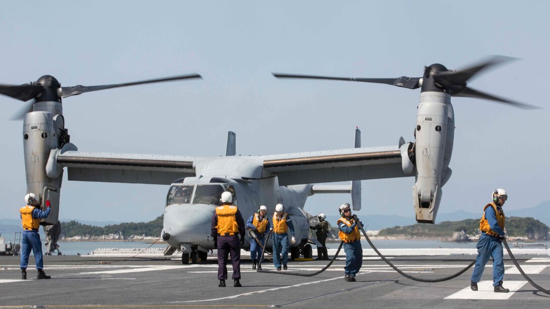Japan Maritime Self Defense Force personnel finish refueling a U.S. Marine Corps MV-22B Osprey tiltrotor aircraft from Marine Medium Tiltrotor Squadron 265 (Reinforced), 31st Marine Expeditionary Unit, aboard the JS Hyuga, at sea, April 22, 2016. The Osprey received supplies from the Hyuga in support of the relief effort after a series of earthquakes struck the island of Kyushu. The 31st MEU is the only continually forward-deployed MEU and remains the Marine Corps' force-in-readiness in the Asia-Pacific region. 