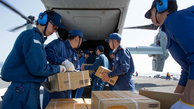 Japan Maritime Self Defense Force personnel, U.S. Navy sailors and U.S. Marines load supplies onto a U.S. Marine Corps MV-22B Osprey tiltrotor aircraft from Marine Medium Tiltrotor Squadron (VMM) 265 (Reinforced), 31st Marine Expeditionary Unit (MEU) aboard the JS Hyuga (DDH 181), at sea, April 22, 2016. The supplies are in support of relief efforts after a series of earthquakes struck the island of Kyushu. The 31st MEU is the only continually forward-deployed MEU and remains the Marine Corps' force-in-readiness in the Asia-Pacific region.