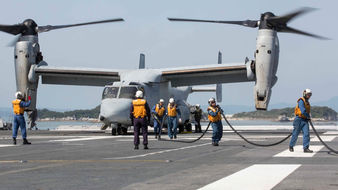 Japan Maritime Self Defense Force personnel finish refueling a U.S. Marine Corps MV-22B Osprey tiltrotor aircraft from Marine Medium Tiltrotor Squadron (VMM) 265 (Reinforced), 31st Marine Expeditionary Unit (MEU), aboard the JS Hyuga (DDH 181), at sea, April 22, 2016. The Osprey recieved supplies from the Hyuga in support of the relief effort after a series of earthquakes struck the island of Kyushu. The 31st MEU is the only continually forward-deployed MEU and remains the Marine Corps' force-in-readiness in the Asia-Pacific region. (U.S. Marine Corps photo by Cpl. Darien J. Bjorndal, 31st Marine Expeditionary Unit/ Released)