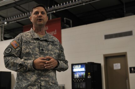 Lt. Col. Henry Capello, the Cyber Shield 16 (CS16) Exercise Commander and Louisiana Army National Guard Information Operations Planner, briefs the service members and civilians participating in CS16 at Camp Atterbury, Ind., April 18, 2016. Cyber Shield is an Army National Guard cyber training exercise designed to develop cyber capable forces, including Army Reserve soldiers, Marines, National guardsmen and civilians from state and federal agencies. (U.S. Army photo by Sgt. Stephanie Hargett)