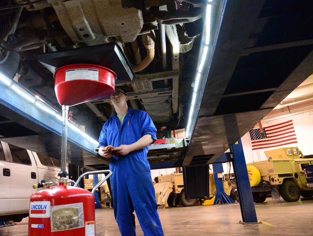 Airman 1st Class Michael Schulz, 341st Logistics Readiness Squadron vehicle management flight mechanic, changes the oil of a government vehicle March 22, 2016, at Malmstrom Air Force Base, Mont. Schulz was one of two Airmen tasked with changing the oil of six vehicles which will be testing a new bio-based synthetic oil which could potentially help the Air Force’s initiative to use more sustainable materials and be environmentally conscious.