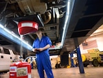 Airman 1st Class Michael Schulz, 341st Logistics Readiness Squadron vehicle management flight mechanic, changes the oil of a government vehicle March 22, 2016, at Malmstrom Air Force Base, Mont. Schulz was one of two Airmen tasked with changing the oil of six vehicles which will be testing a new bio-based synthetic oil which could potentially help the Air Force’s initiative to use more sustainable materials and be environmentally conscious.