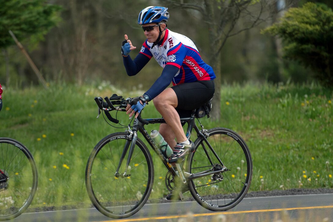 Coast Guard Adm. Paul F. Zukunft, front, commandant of the Coast Guard, participates in the Face of America bike ride near Frederick, Md., April 23, 2016. DoD photo by EJ Hersom