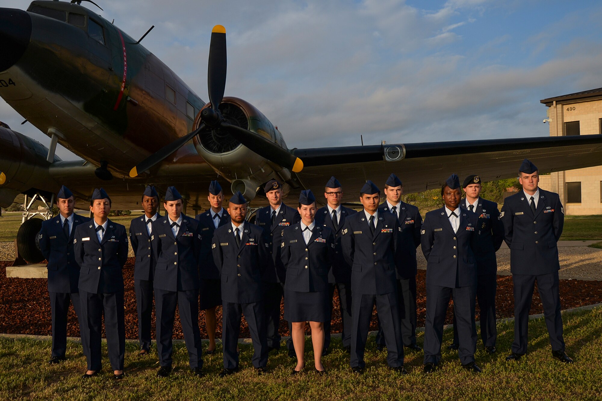 Airman Leadership School class 16-C students pose for a group photo in front of a static plane display on Goodfellow Air Force Base, Texas, April 12. The students graduated April 21. (U.S. Air Force photo by Airman 1st Class Randall A. S. Moose/Released)