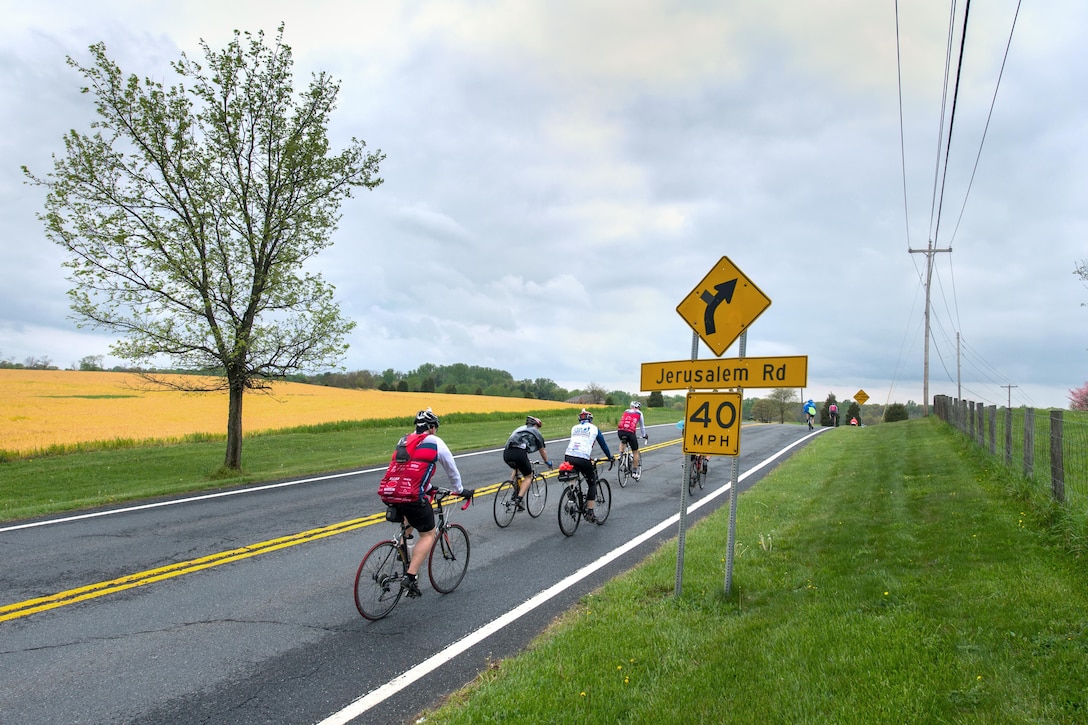 Active-duty service members, veterans and civilian cyclists travel through Beallsville, Md., April 23, 2016, during the Face of America bike ride. DoD photo by EJ Hersom 