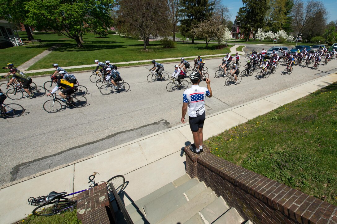 A bicyclist records video of active-duty service members, veterans and civilians participating in the Face of America bike ride in Gettysburg, Pa., April 24, 2016. DoD photo by EJ Hersom