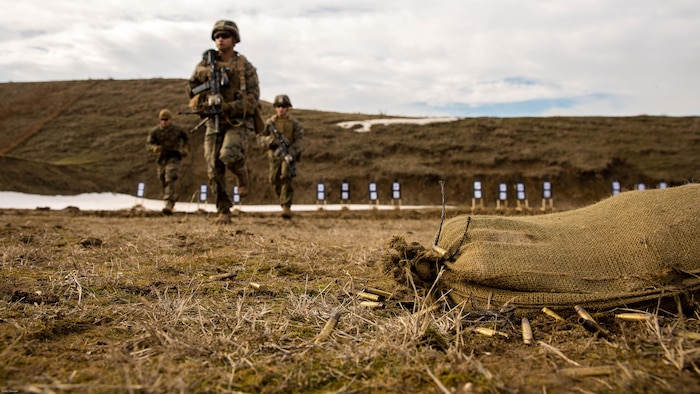 U.S. Marines with Black Sea Rotational Force move to the 100 yard line to shoot their conformation group during a live-fire exercise aboard Mihail Kognalniceanu Air Base, Romania, Feb. 2, 2016. Marines from 1st Battalion, 8th Marine Regiment, conducted battle sight zeroes on various individual weapons systems, to prepare for future BSRF exercises and contingencies. 