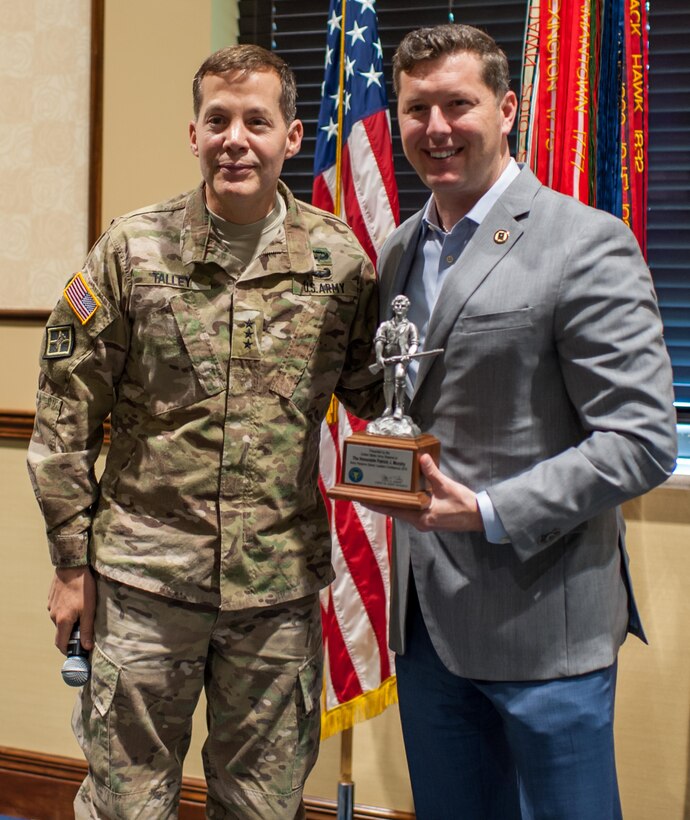 Lt. Gen. Jeffrey W. Talley, Chief, U.S. Army Reserve and U.S. Army Reserve Command commanding general, presents the Hon. Patrick J. Murphy, Acting Secretary of the Army, with a statue of John Parker, the symbol of the U.S. Army Reserve at the Iron Mike Conference, April 23, 2016, Fort Bragg, NC. Murphy summed his time with the U.S.Army Reserve senior leaders by saying the Army is “America’s varsity team” and needs to be ready at a moment’s notice. And the U.S. Army Reserve is an integral part of the team. “When the President or these governors ask us to respond, we can’t say, ‘I’m sorry.’ We’ve got to be ready to go. We’ve got be ready to go tonight. That’s why readiness is so important,” Murphy said. He also was the guest speaker later in the evening at the U.S. Army Reserve 108th anniversary ball. (U.S. Army photo by Timothy L. Hale) (Released)