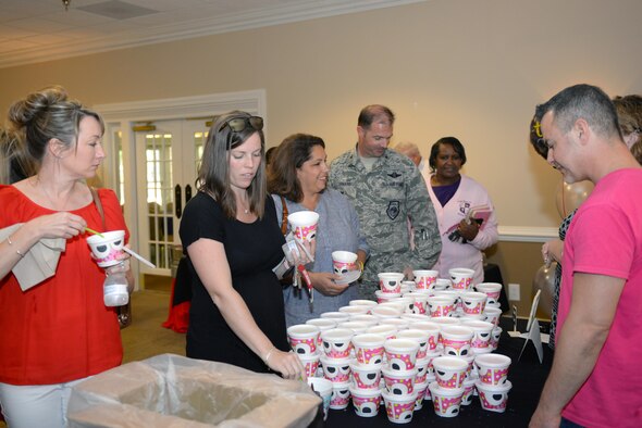 Attendees at the Volunteer Appreciation Event participate in an ice cream social after the ceremony, April 20, 2016, at Seymour Johnson Air Force Base, North Carolina. An array of desserts, including ice cream and cake, was provided to celebrate the hard work of volunteers. (U.S. Air Force photo by Airman 1st Class Ashley Williamson/Released)