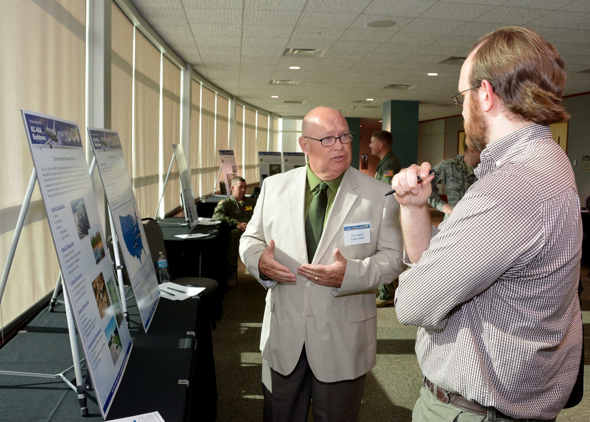 Tim Taylor, an Environmental Health Specialist with the 72nd Air Base Wing Civil Engineer Environmental Compliance Office at Tinker Air Force Base, Okla., briefs a local reporter at the KC-46A public scoping meeting April 21, 2016, at the Sheraton Reed Conference Center in Midwest City, Okla. (U.S. Air Force photo/Tech. Sgt. Lauren Gleason)