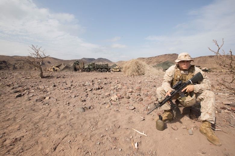 Corporal Corey Osborne, a cannoneer with the 13th Marine Expeditionary Unit, stands security Djibouti, Apr. 9, 2016. Cpl. Osborne acts as a look out as Marines and Sailors from Combat Logistics Battalion 13, the logistics combat element for the 13th MEU, fortify the encampment being built. The 13th MEU is conducting sustainment training to maintain proficiency and combat readiness while deployed with the Boxer Amphibious Ready Group during Western Pacific Deployment 16-1. (U.S. Marine Corps photo by Cpl. Alvin Pujols/RELEASED)