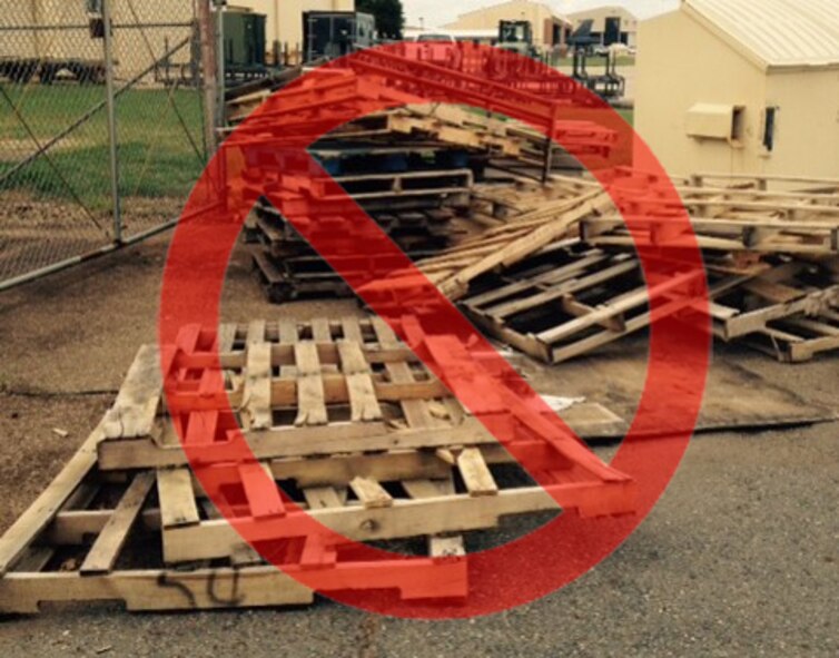 Pallets are illegally disposed of by a dumpster on Barksdale Air Force Base, La. The spring season brings up problems such as illegal dumping increasing the number of old mattresses, television sets and other items being disposed of incorrectly around Barksdale. (Courtesy photo)