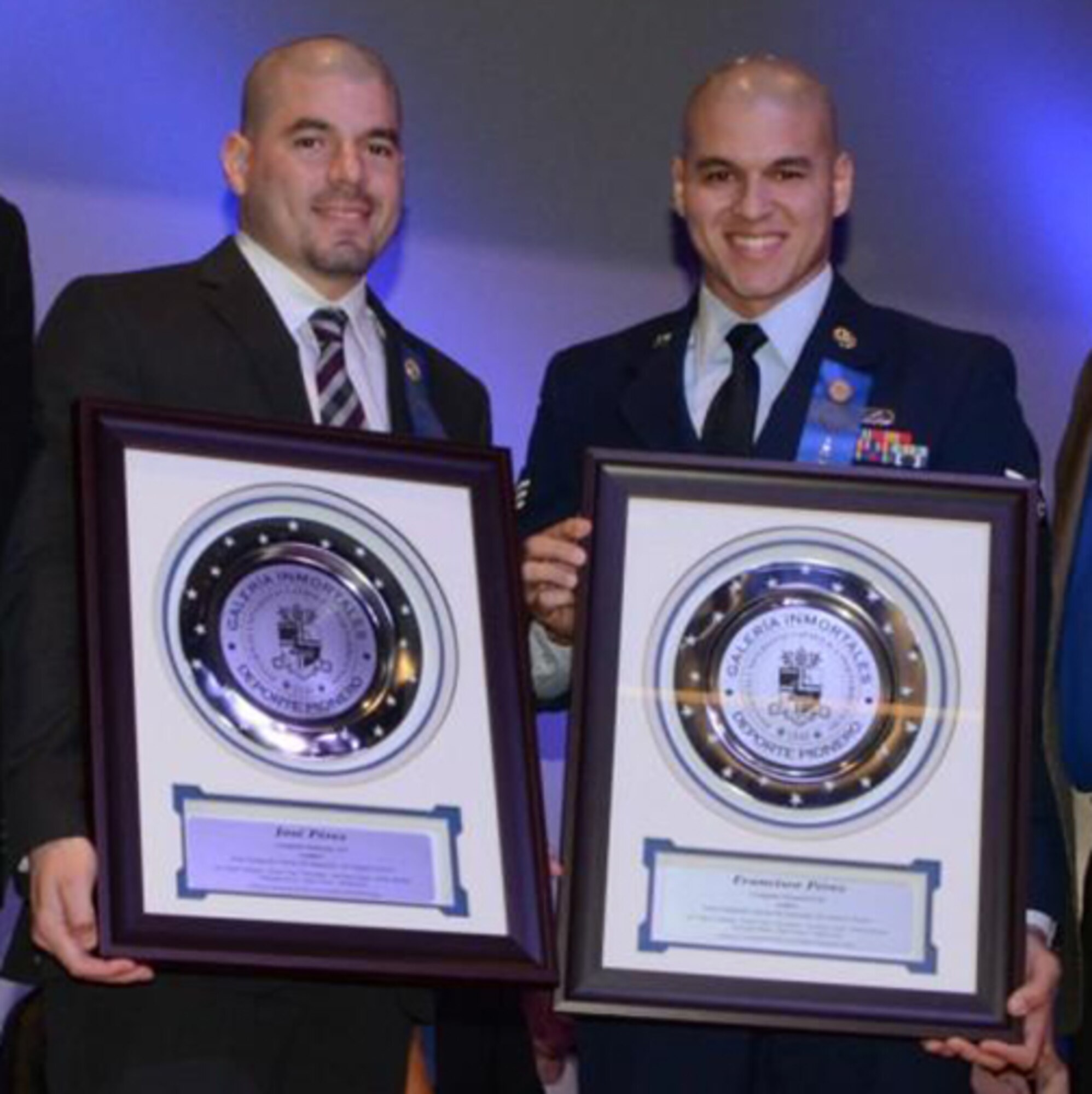 Senior Airman Francisco Perez Castillo, of the 96th Maintenance Group, right, and his brother, Jose, were both inducted into the Pontifical Catholic University of Puerto Rico’s sports hall of fame in December 2015. Perez Castillo and his brother swam competitively for their national and university teams while growing up. (Courtesy photo)