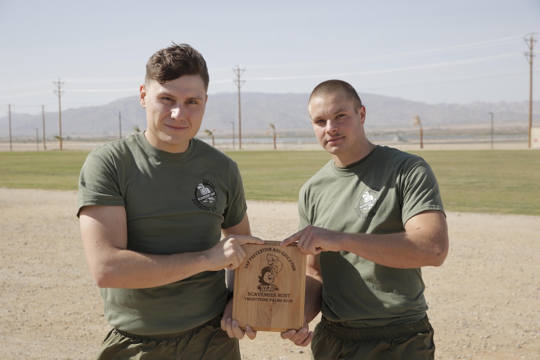 Cpl. Jimmy Carter, rifleman, and Pfc. James Swain, motor technician operator, 2nd Battalion, 7th Marine Regiment earned a plaque for winning the Substance Abuse Program’s Scavenger Hunt April 15, 2016. (Official Marine Corps photo by Pfc. Dave Flores/Released)