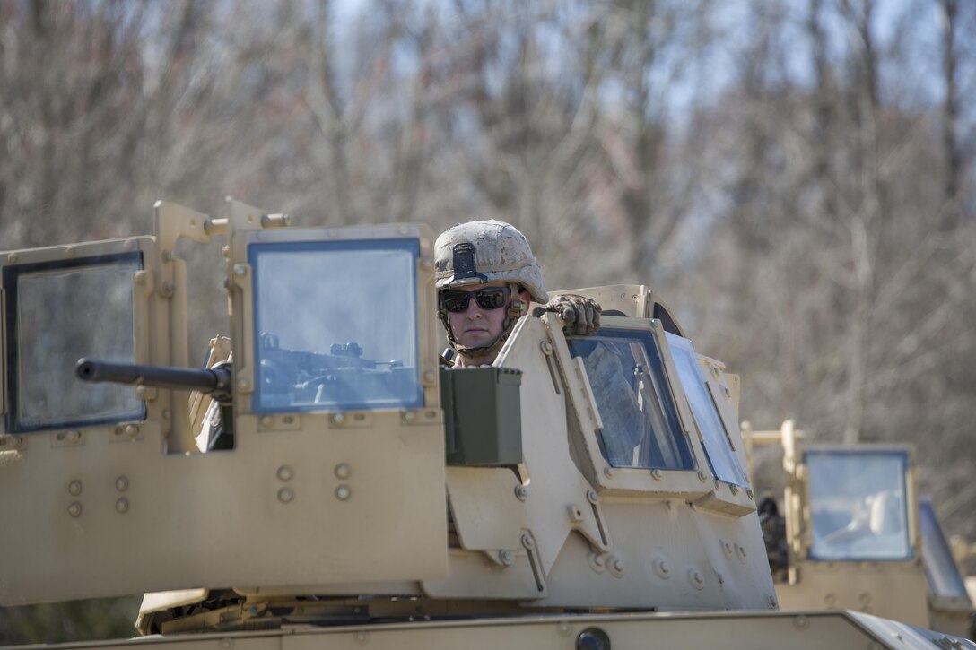 Cpl. Peter Merkel, a machine gunner with 2/24 Battalion, 23rd Marine Regiment, 4th Marine Division, Marine Forces Reserve prepares for a fire and maneuver range during a fire support coordination exercise in Camp Atterbury, Ind.,  April 13, 2016. The exercise focused on combined arms and coordination with the U.S. Air Force and U.S. Army units to complete various missions. 