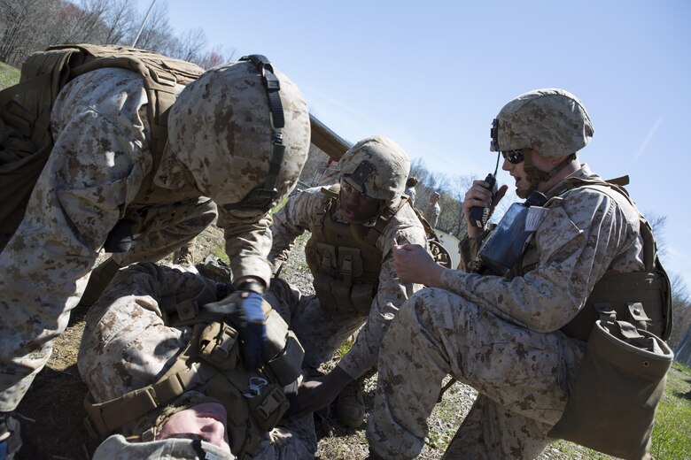 Reserve Marines with 2/24, 23rd Marine Regiment, 4th Marine Division, Marine Forces Reserve and Anti-Tank Training Company, 4th MarDiv, MFR, call in a casualty evacuation drill during a fire support coordination exercise, in Camp Atterbury, Ind., April 13, 2016. The Marines trained various individual skills and mission essential tasks during the exercise including participation in a combined, anti-armor team range. 