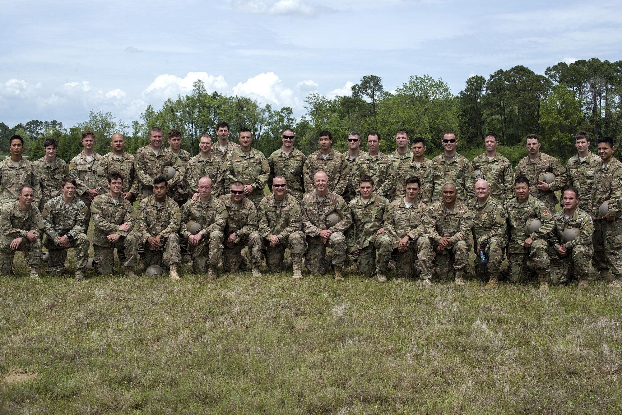 U.S. Air Force Airmen from the 820th Base Defense Group pose for a photo after a memorial jump ceremony, April 21, 2016, at Henry Tift Myers Airport, Tifton, Ga. This was the first jump in the Lee D. Fulp Drop Zone, in honor of the fallen Moody Airman. (U.S. Air Force photo by Airman 1st Class Janiqua P. Robinson/Released)