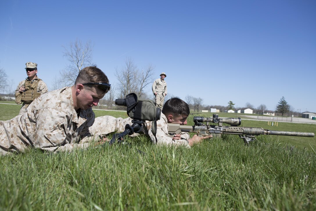 Lance Cpl. John Slager (right) and Lance Cpl. Eric Dragon (left), scout snipers with 2/24 Battalion, 23rd Marine Regiment, 4th Marine Division, Marine Forces Reserve, finish their qualifications on the range during a fire support coordination exercise in Camp Atterbury, Ind.,  April 14, 2016. Along with completing their qualifications the Marines worked with Company B, 8th Battalion, 229th Aviation Regiment (8-229 AV), 11th Aviation Command (Theater), a U.S. Army Blackhawk crew, to hone their skills in casualty evacuations and insertion exercises into enemy lines. 