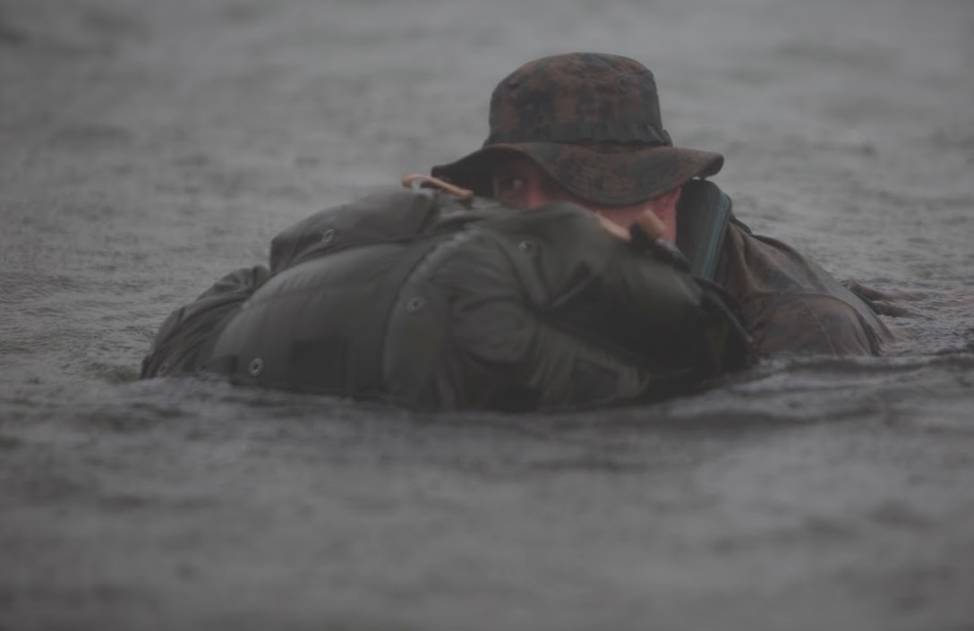 Petty Officer 3rd Class Josiah S. Gravelle, a hospital corpsman with Company E, 4th Reconnaissance Battalion, 4th Marine Division, Marine Forces Reserve finishes a 5000 meter fin swim during a Fleet Marine Force reconnaissance corpsman screening at Canyon Lake, Texas, April 21, 2016. The screening was hosted by 4th Reconnaissance Battalion for Reserve Sailors to gain familiarity with the demands of the FMF reconnaissance corpsman pipeline.