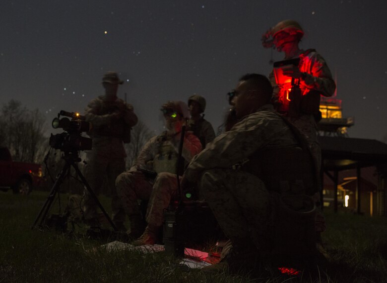 Reserve Marines with 2/24 Battalion, 23rd Marine Regiment, 4th Marine Division, Marine Forces Reserve, and 4th Air Naval Gunfire Liaison Company, Force Headquarters Group, MFR, call in fire support from pilots manning the A-10 Thunderbolt II, a low-altitude close air support aircraft, while conducting night operations during a fire support coordination exercise in Camp Atterbury, Ind., April 15, 2016. The Reserve Marines coordinated with both the U.S. Army and U.S. Air Force to conduct combined arms training during the exercise. 