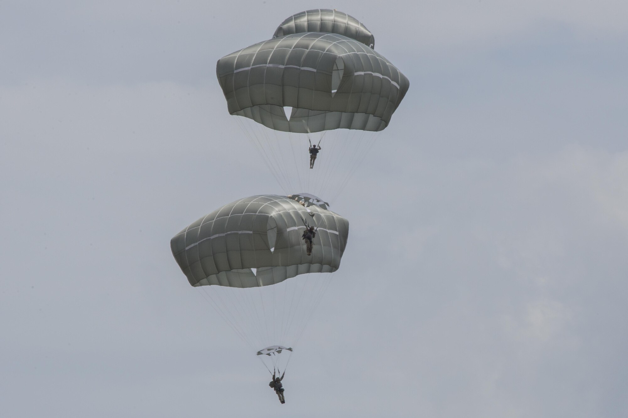 U.S. Air Force Airmen from the 820th Base Defense Group descend during a memorial jump ceremony, April 21, 2016, at Henry Tift Myers Airport, Tifton, Ga. The memorial was for Tech. Sgt. Lee Fulp. (U.S. Air Force photo by Airman Daniel Snider/Released)