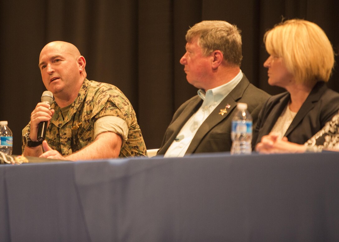 Lt. Cmdr. Thomas Perdue, a chaplain with 10th Marine Regiment, speaks to the Marines and Sailors of the regiment during a child abuse awareness and prevention symposium at Camp Lejeune, N.C., April 22, 2016. The purpose of the symposium was to make the Marines aware of the various resources available to them through their units and Marine Corps Community Services. (U.S. Marine Corps photo by Cpl. Michelle Reif/Released.)