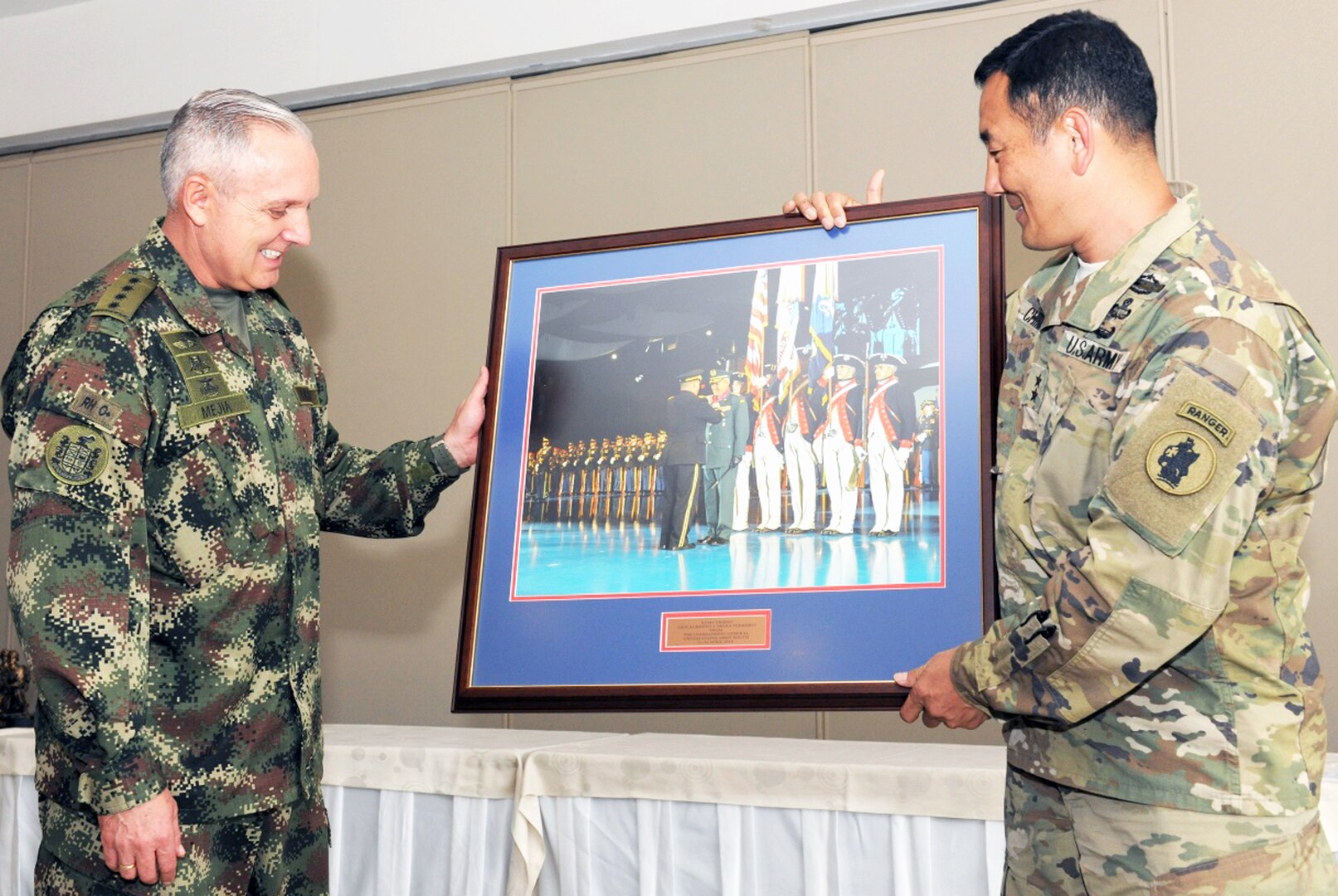 Maj. Gen. K.K. Chinn (right), U.S. Army South commander, presents a framed photo to Gen. Alberto Jose Mejia, Colombian army commander, during the closing ceremony of the 2016 U.S.-Colombia
Bilateral Army Staff Talks Executive Meeting in Bogota, Colombia April 14. The framed photo is significant since it was taken when Mejia was in Washington, D.C., last February for the Conference of the American Armies transfer ceremony where U.S. Army Chief of Staff Gen. Mark A. Milley presented him with the Legion of Merit.