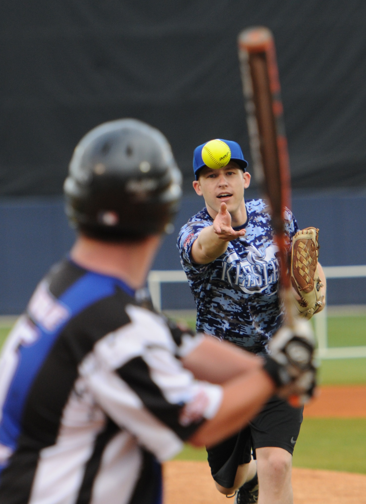 Tyler Bouldin, WLOX reporter and “Boots” team member, pitches a softball to Tony DeRosa, Special Olympics athlete, during the “Boots versus Badges” softball game at the Biloxi Shuckers MGM Park April 21, 2016, Biloxi, Miss. The game was the kickoff event for the 2016 Special Olympics Mississippi Summer Games, which will be hosted by Keesler Air Force Base, Miss., May 20-21.  (U.S. Air Force photo by Kemberly Groue)