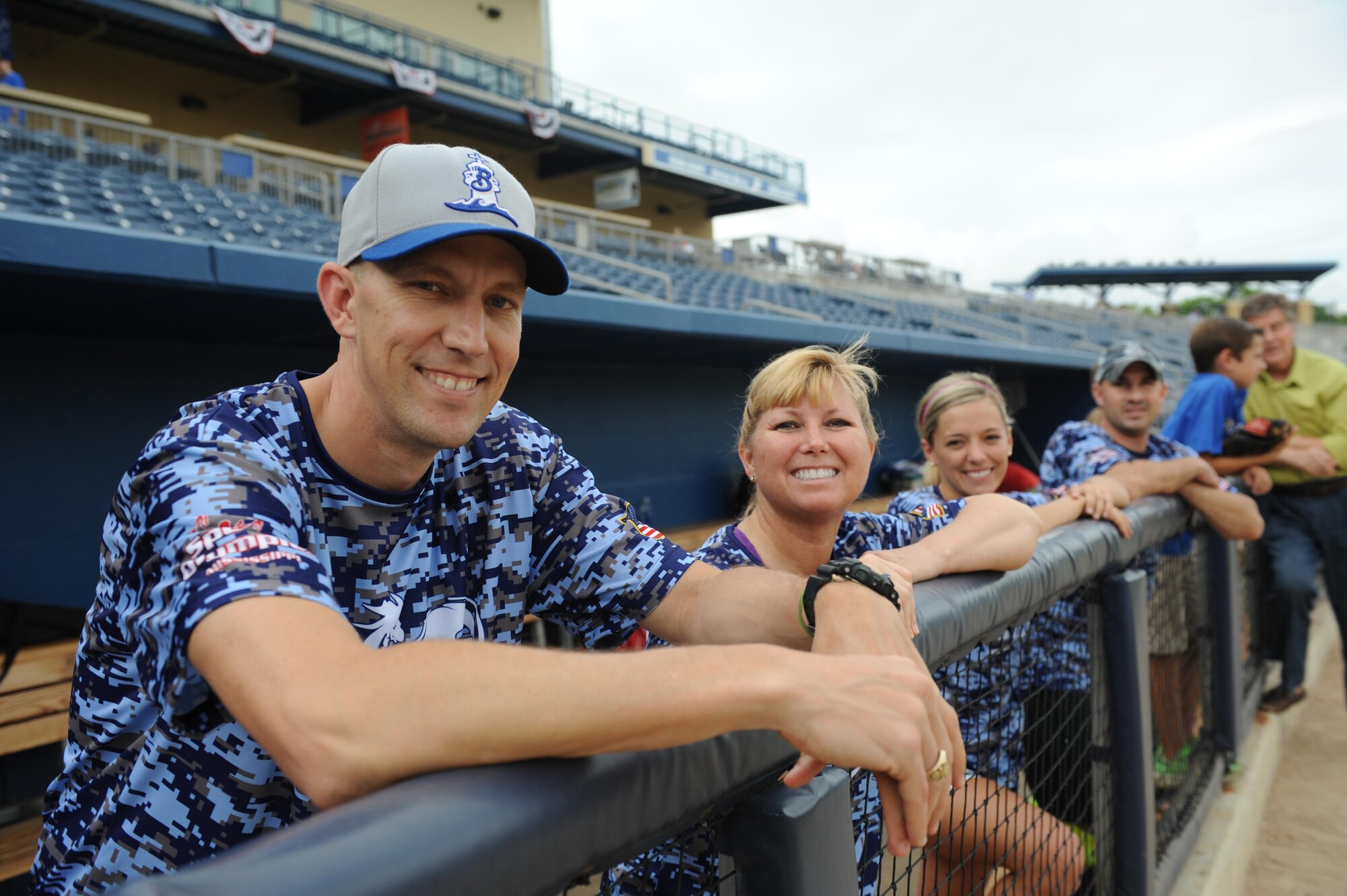 Members of the “Boots” team pose for a photo from their dugout during the “Boots versus Badges” softball game at the Biloxi Shuckers MGM Park April 21, 2016, Biloxi, Miss. The game was the kickoff event for the 2016 Special Olympics Mississippi Summer Games, which will be hosted by Keesler Air Force Base, Miss., May 20-21. (U.S. Air Force photo by Kemberly Groue)