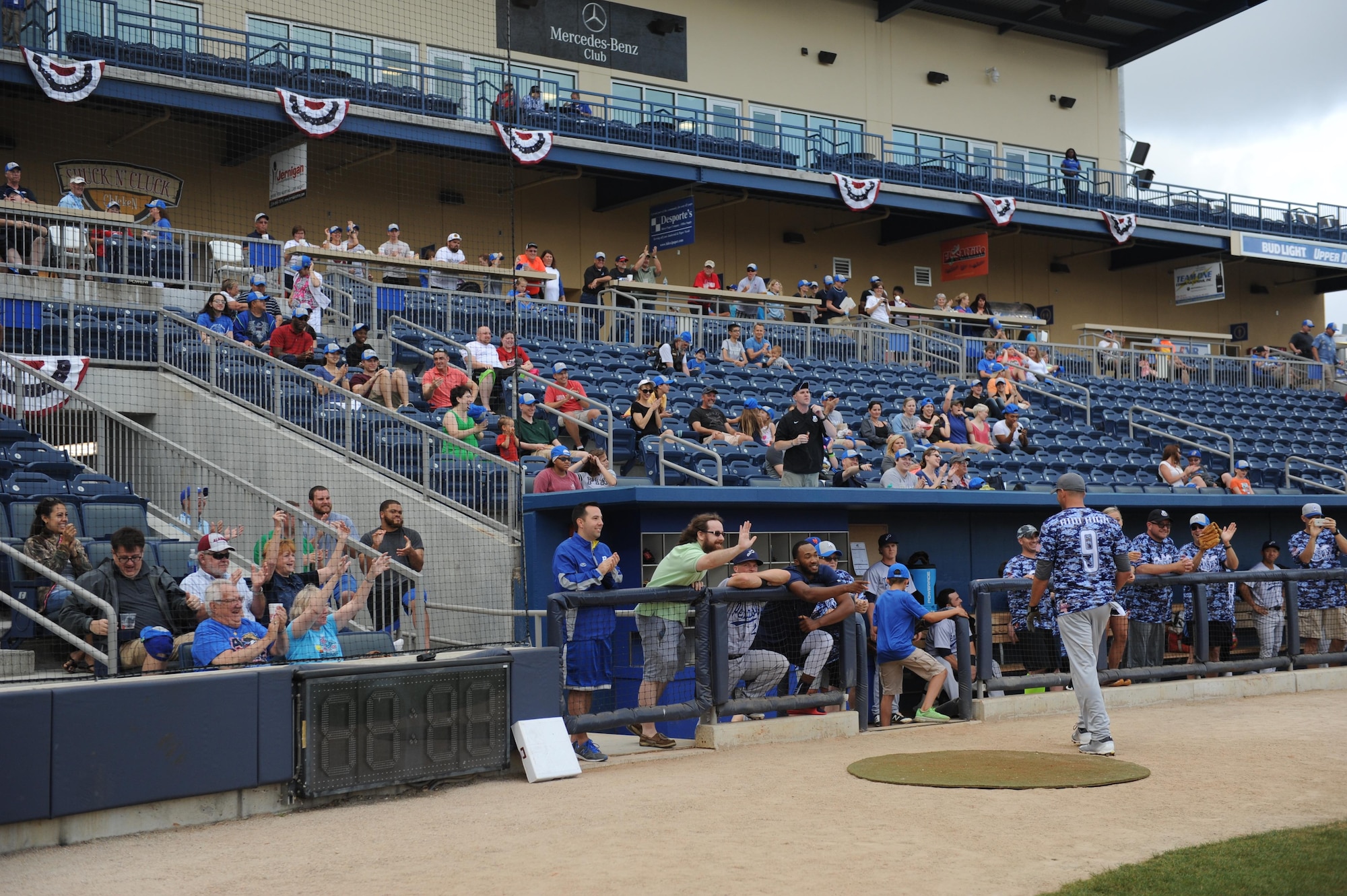Spectators cheer in the stands during the “Boots versus Badges” softball game at the Biloxi Shuckers MGM Park April 21, 2016, Biloxi, Miss. The game was the kickoff event for the 2016 Special Olympics Mississippi Summer Games, which will be hosted by Keesler Air Force Base, Miss., May 20-21. (U.S. Air Force photo by Kemberly Groue)