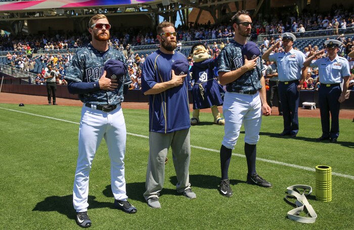 Players with the San Diego Padres stand in appreciation while the national anthem is sung in the opening ceremony of the San Diego Padres game at Petco Park, April 17. To honor San Diego’s service members, veterans and their families, the Padres players wear camouflage jerseys. The organization honors each branch of the armed forces with special salutes to military children, military spouses and military families.