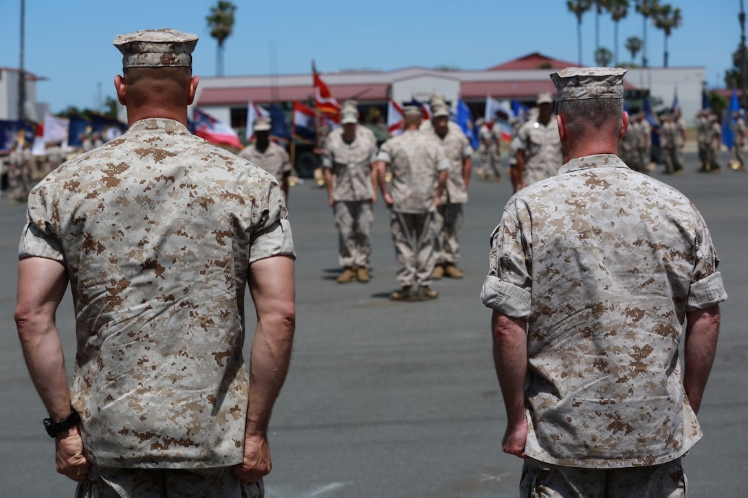 MARINE CORPS BASE, CAMP PENDLETON,Calif. – Col. Vance L. Cryer (left) the out-going commanding officer for the 15th Marine Expeditionary Unit, and Col. James P. Fallon, the unit’s oncoming commanding officer, stand ready to salute Marines during a pass in review during a change of command ceremony on Camp Pendleton April 22, 2016. During the ceremony Cryer relinquished command of the unit to Fallon who previously was the MEU’s executive officer. (Marine Corps photo by Cpl. Jonathan Boynes/Released)