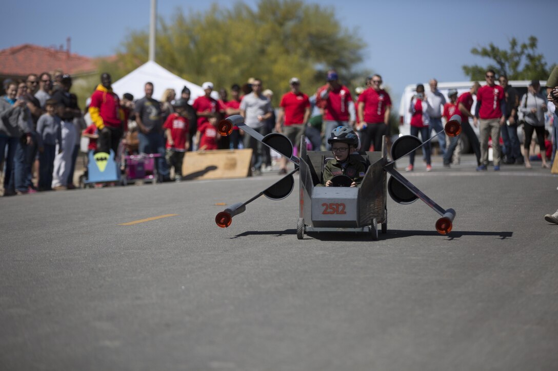 Chase Gantz, 6, son of Capt. Wayne Gantz, Combat Center Aide-de-Camp, races his opponent during the  Twentynine Palms Car Show and Street Fair at Luckie Park in Twentynine Palms, Calif., April 16, 2016. (Official Marine Corps photo by Cpl. Julio McGraw/Released)