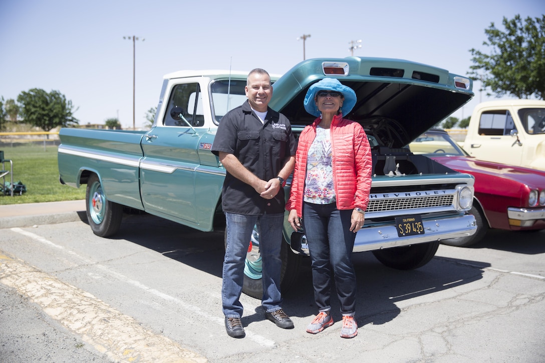 Lt. Col. Dennis Sanchez, commanding officer, Headquarters Battalion, stands with the General’s Choice Award winner, Sue Duke and her husband Kenny Duke’s 1965 Chevrolet C20 Pickup during the Twentynine Palms Car Show and Street Fair at Luckie Park in Twentynine Palms, Calif., April 16, 2016. (Official Marine Corps photo by Cpl. Julio McGraw/Released)