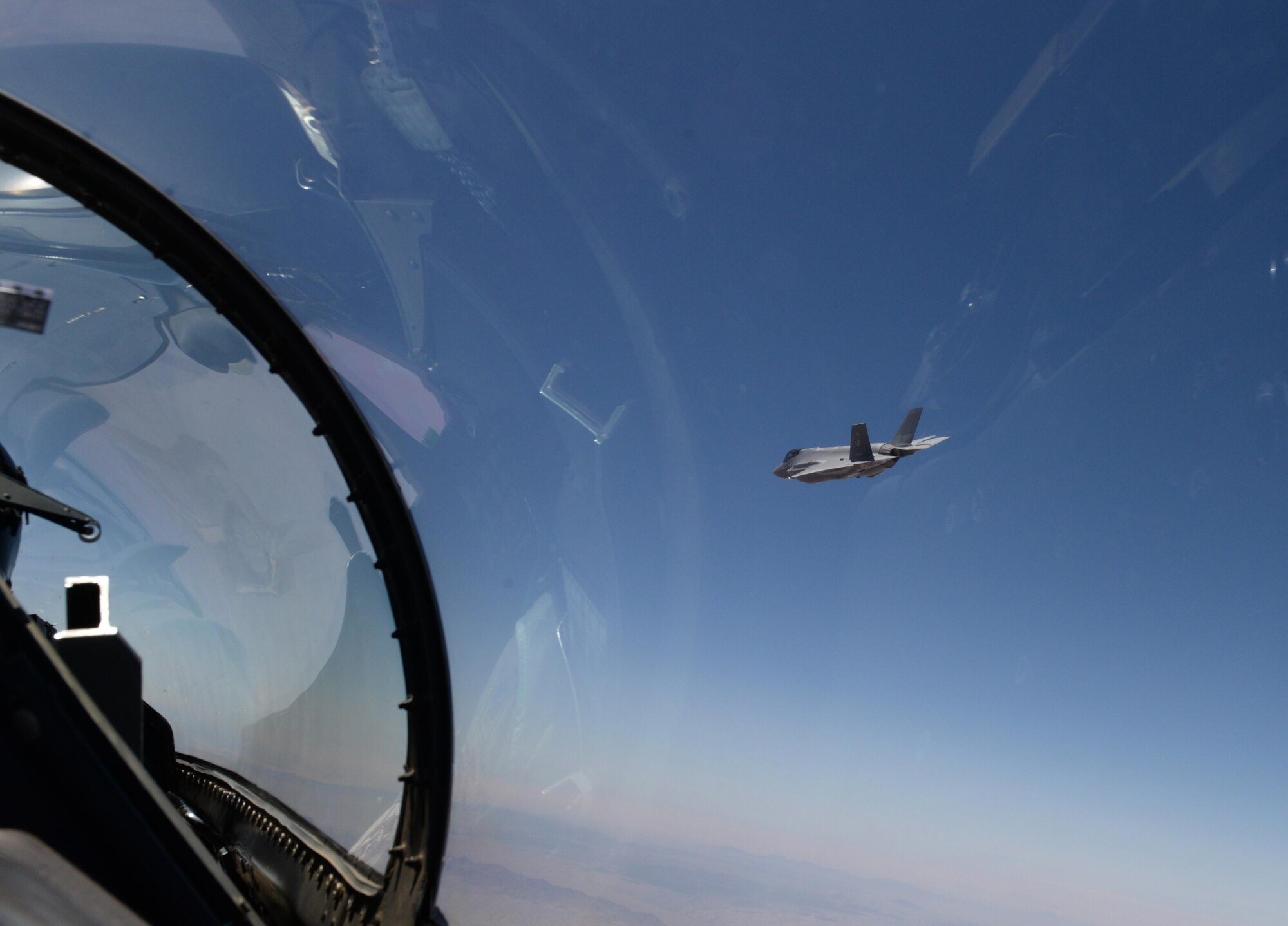 An F-35 Lightning II from the 61st Fighter Squadron banks left to circle back around after dropping a GBU-12 500-pound laser-guided bomb April 25, 2016, at the Barry M. Goldwater Range in Gila Bend, Ariz. Three F-35s successfully delivered six inert GBU-12s during the practice sortie, making the 61st FS the second squadron at Luke Air Force Base to drop bombs from the F-35. (U.S. Air Force photo by Airman 1st Class Ridge Shan)