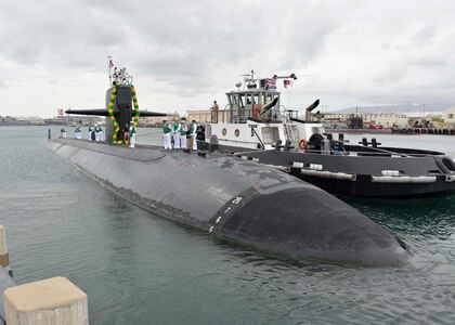PEARL HARBOR (Feb. 25, 2015) Sailors aboard the Los Angeles-class attack submarine USS Olympia (SSN 717) prepare to moor at the submarine piers at Joint Base Pearl Harbor-Hickam after completing a six-month deployment.