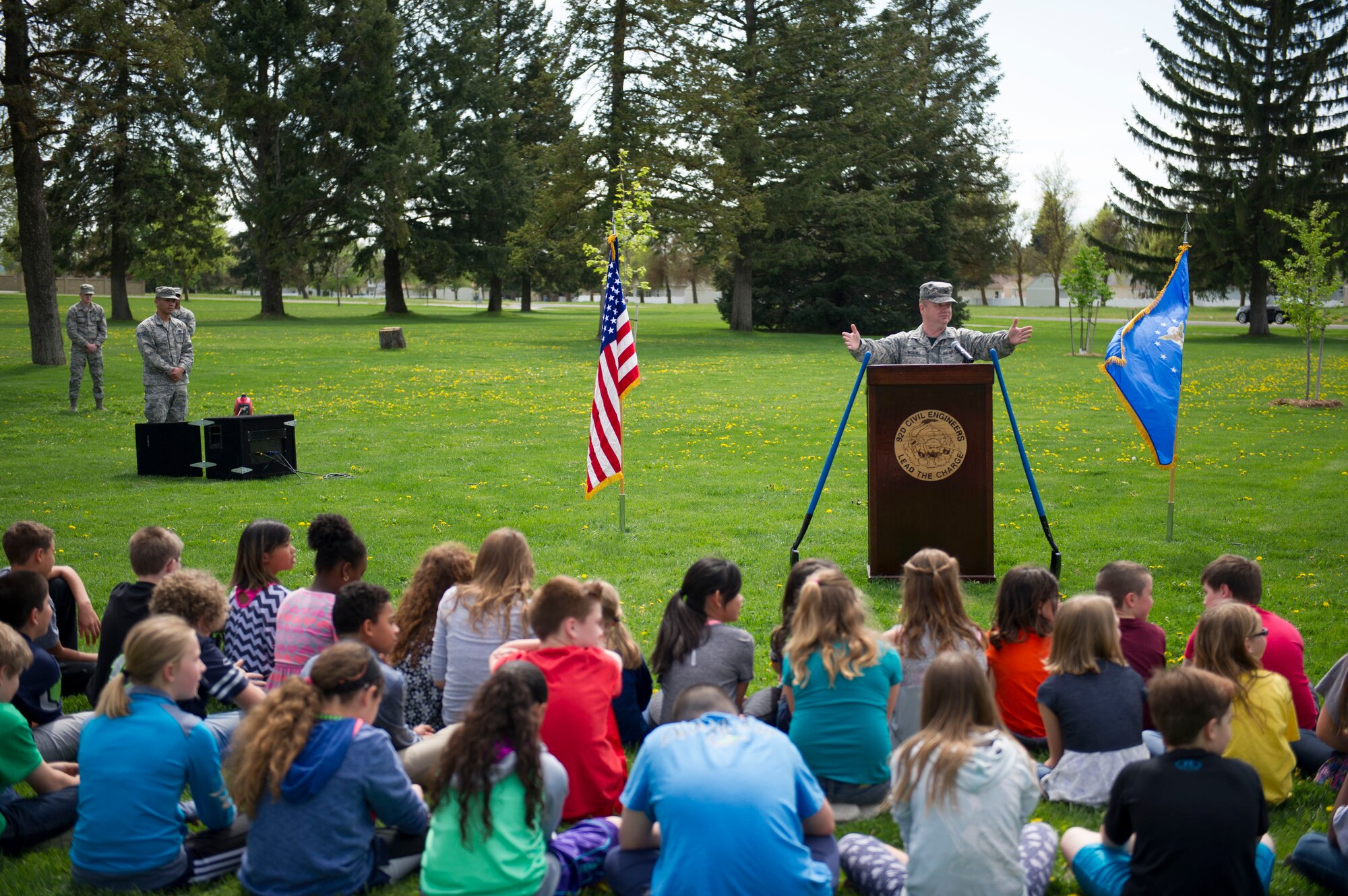 Col. Brian McDaniel, 92nd Air Refueling Wing commander, speaks with school children during an Arbor Day ceremony April 22, 2016, at Fairchild Air Force Bases, Wash. This year, the Air Force is highlighting its commitment to “cleaner, greener installations,” with emphasis on energy and water conservation. (U.S. Air Force photo/Airman 1st Class Sean Campbell)