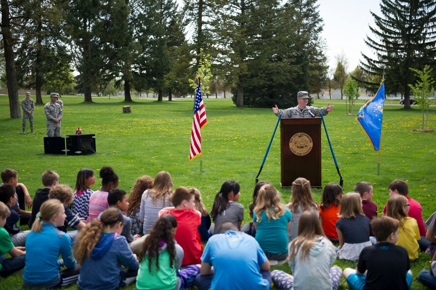 Col. Brian McDaniel, 92nd Air Refueling Wing commander, speaks with school children during an Arbor Day ceremony April 22, 2016, at Fairchild Air Force Bases, Wash. This year, the Air Force is highlighting its commitment to “cleaner, greener installations,” with emphasis on energy and water conservation. (U.S. Air Force photo/Airman 1st Class Sean Campbell)