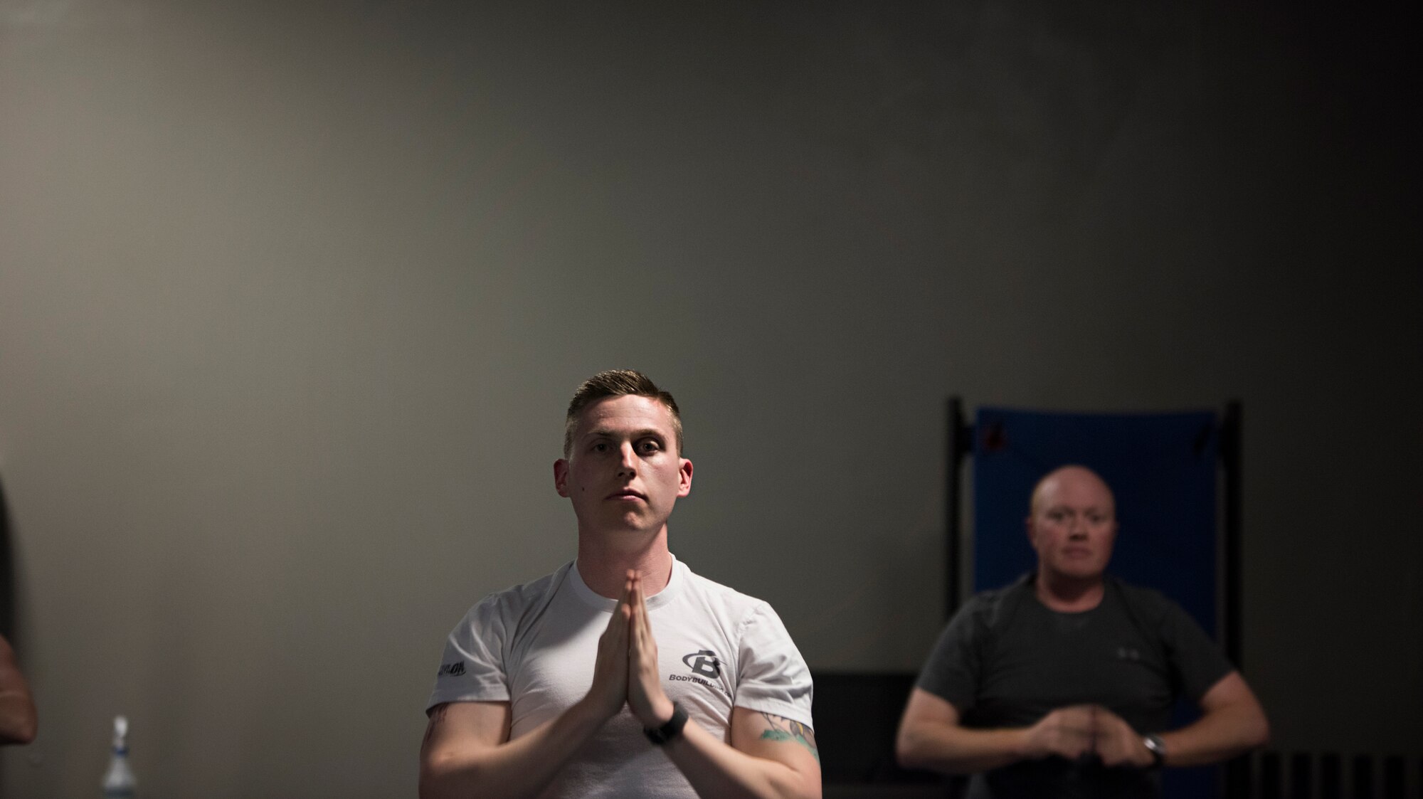 Members of the 305th Operations Support Squadron participate in a yoga class April 19, 2016 at the Falcon Fitness Center at Joint Base McGuire-Dix-Lakehurst, N.J. Yoga is one of several mental and physical fitness initiatives Macaulay and her leadership have implemented in the OSS. (U.S. Air Force photo by Staff Sgt. Katherine Tereyama)