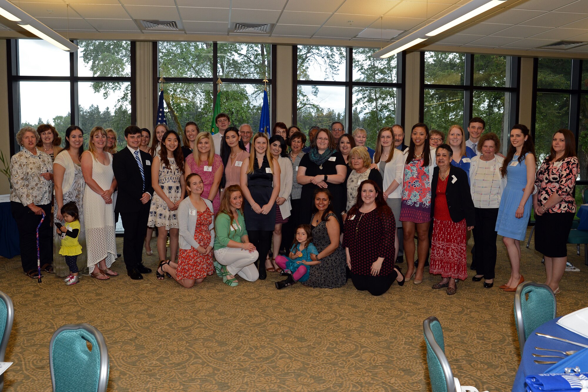 McChord Spouses Club scholarship award recipients take part in a group photo at the McChord Spouses Club 4th annual Shoot for the Stars scholarship reception April 24, 2016, at the American Lake Conference Center on Joint Base Lewis-McChord, Wash. The reception was held to honor the 2016 scholarship recipients and the individuals who have volunteered at the McChord Thrift Shop between June 2015 and April 2016. (U.S. Air Force photo/Senior Airman Jacob Jimenez)  