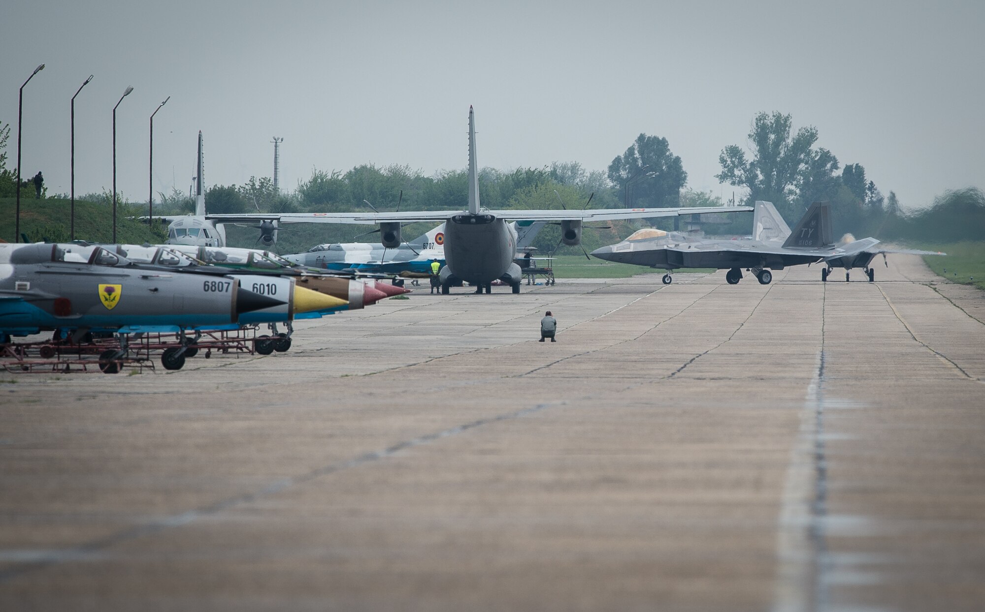 Two U.S. Air Force F-22A Raptors taxi on the flightline at Mihail Kogalniceanu Air Base, Romania, April 25, 2016. The aircraft will conduct air training with other Europe-based aircraft and will also forward deploy from England to maximize training opportunities while demonstrating the U.S. commitment to NATO allies and the security of Europe. The Raptors are deployed from the 95th Fighter Squadron, Tyndall Air Force Base, Florida. (U.S. Air Force photo by Tech. Sgt. Ryan Crane/Released)
