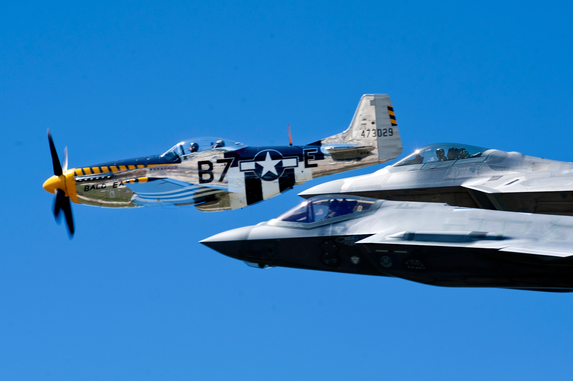 An F-22 Raptor, F-35 Lightning II and P-51 Mustang fly in formation as part of the U.S. Air Force Heritage Flight during the AirPower over Hampton Roads Open House at Langley Air Force Base, Va., April 24, 2016. The U.S. Air Force Heritage Flight program presents the evolution of USAF air power by flying today's state-of-the-art fighter aircraft in close formation with vintage aircraft. (U.S. Air Force photo by Senior Airman R. Alex Durbin)