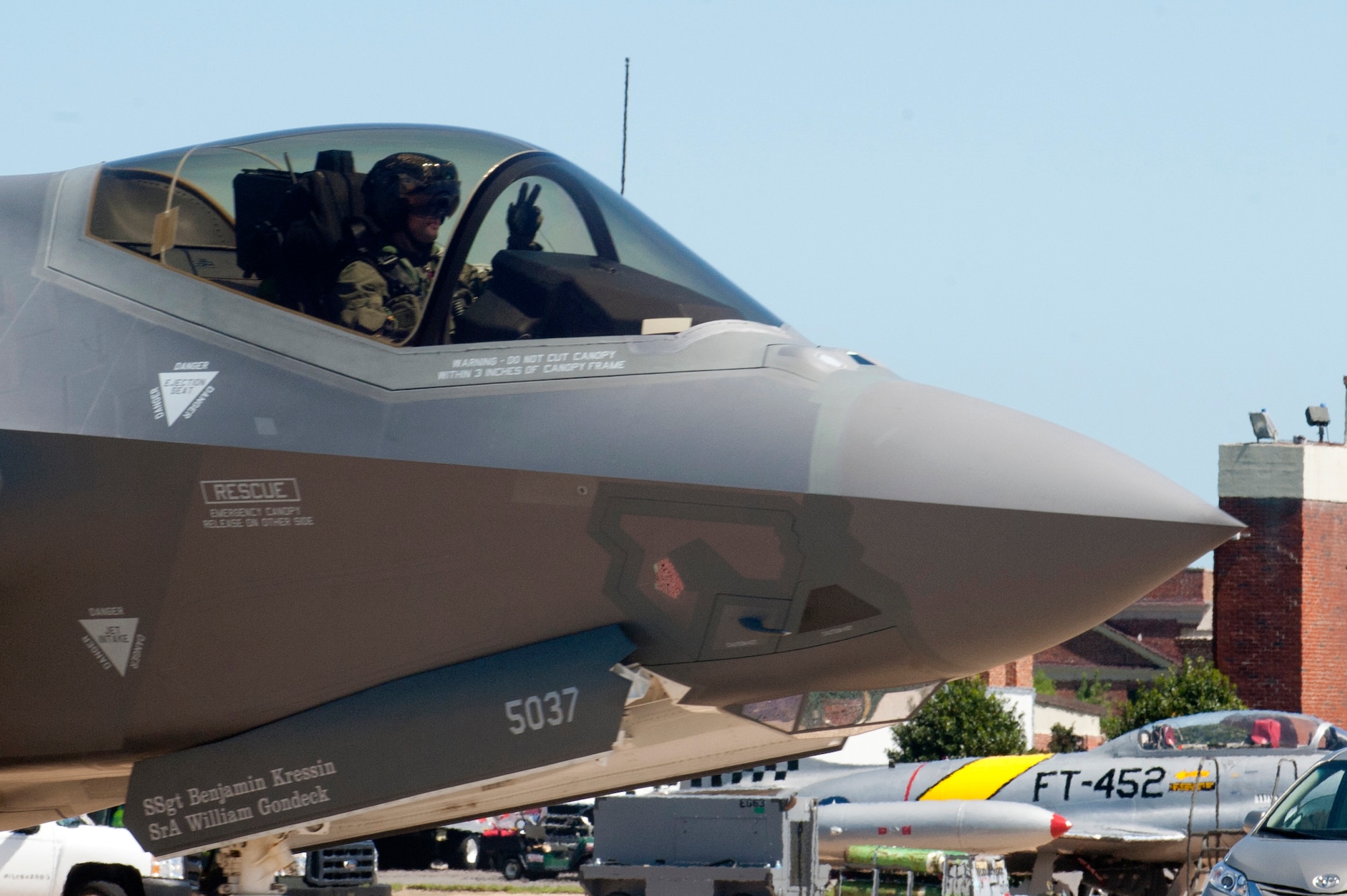 A U.S. Air Force F-35 Lightning II demonstration pilot waves to a crowd during the AirPower over Hampton Roads Open House at Langley Air Force Base, Va., April 24, 2016. With its aerodynamic performance and advanced integrated avionics, the F-35 aims to provide next-generation stealth, enhanced situational awareness and reduced vulnerability for the United States and allied nations across the globe. (U.S. Air Force photo by Senior Airman R. Alex Durbin)