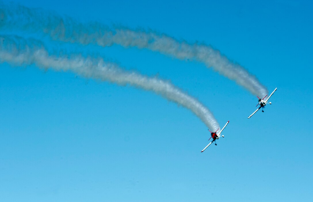 RedLine AirShows performers fly during the AirPower over Hampton Roads Open House at Langley Air Force Base, Va., April 24, 2016. RedLine Airshows is a two-ship team that performs opposing, inverted and formation maneuvers. (U.S. Air Force photo by Senior Airman R. Alex Durbin)